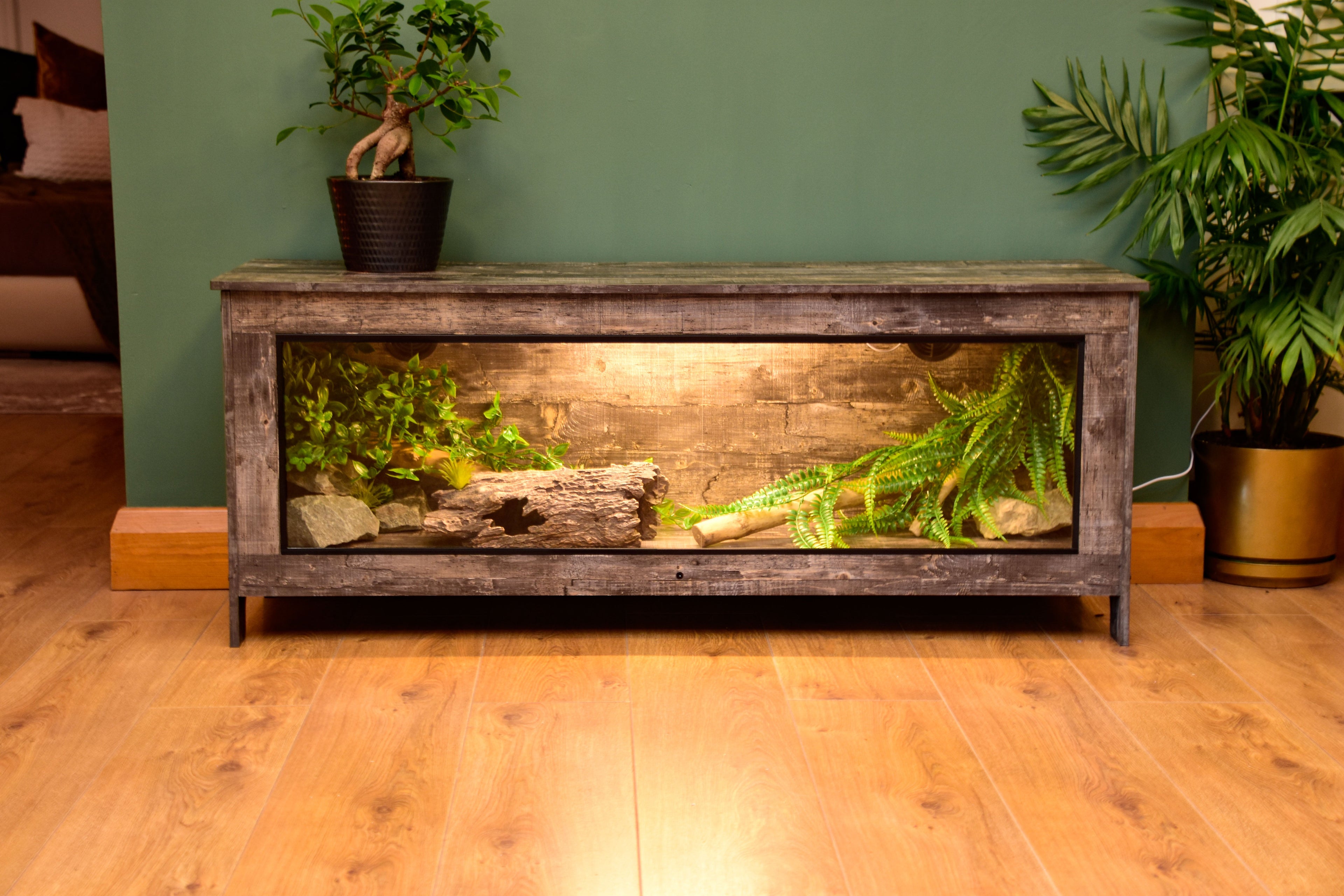 Close-up of ventilation port on distressed wood vivarium