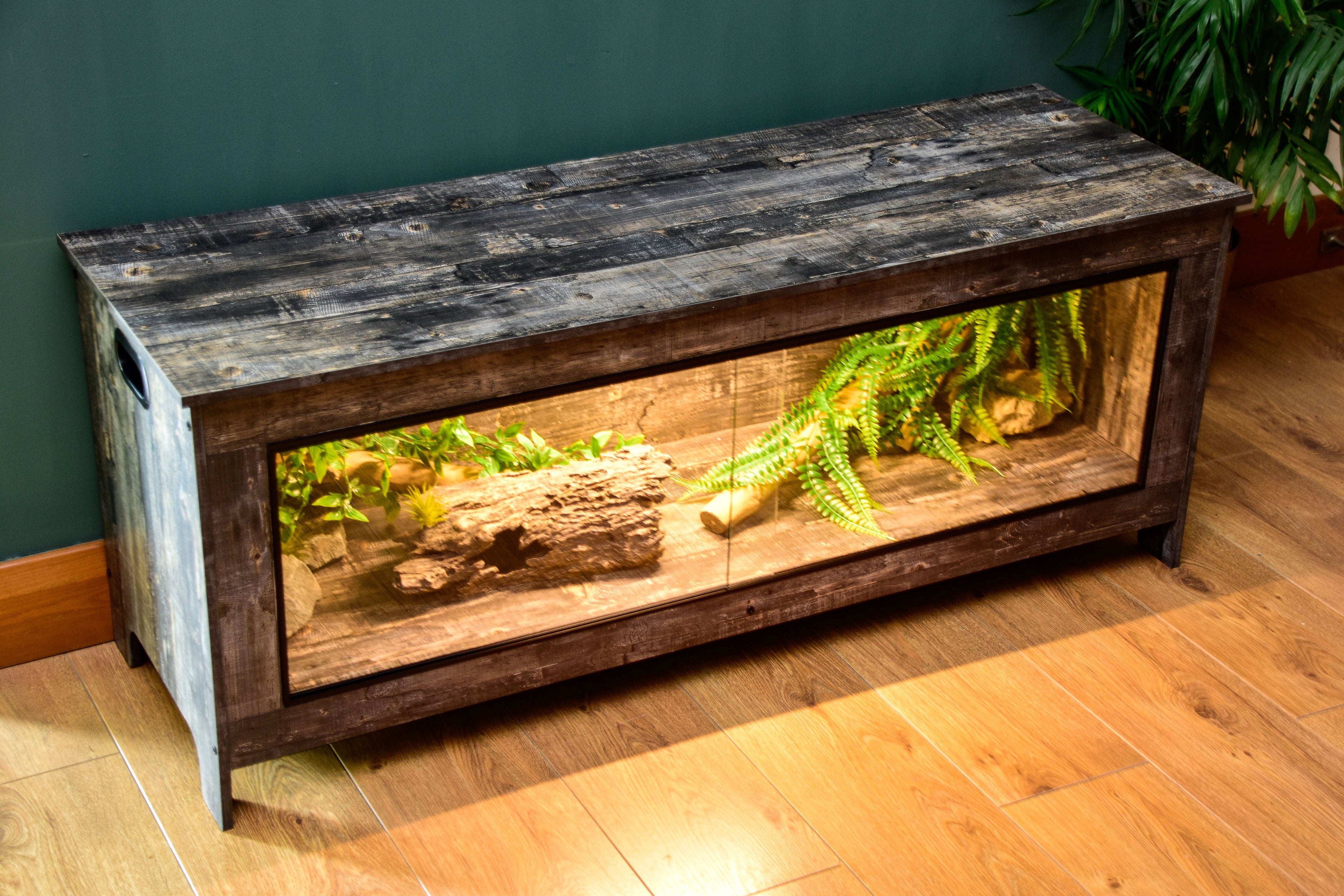 Distressed wood vivarium with open lid showing interior