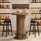 Medium oak bar table with black swivel stools in a bar room